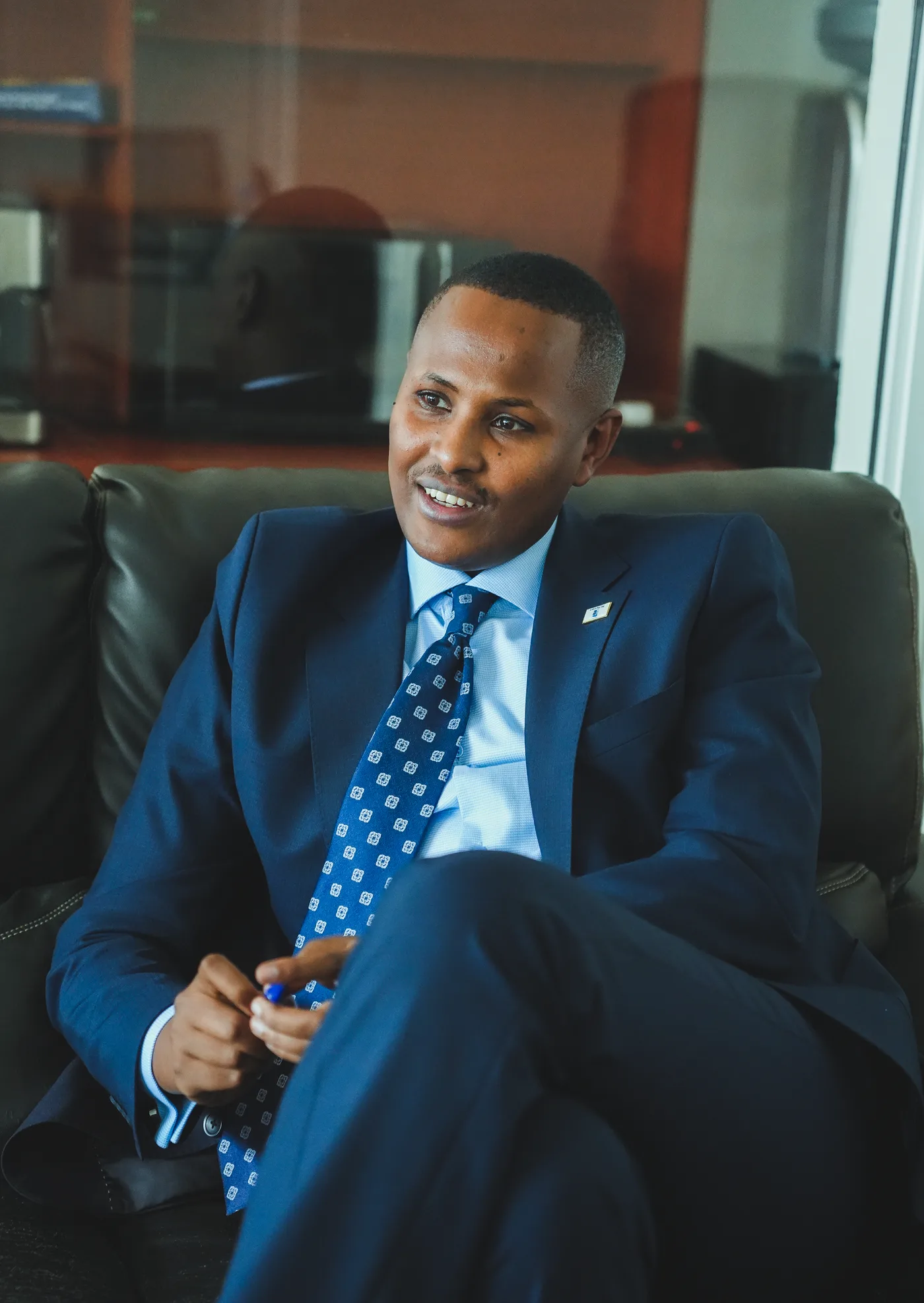 An RG Partners team member in conversation at the office
