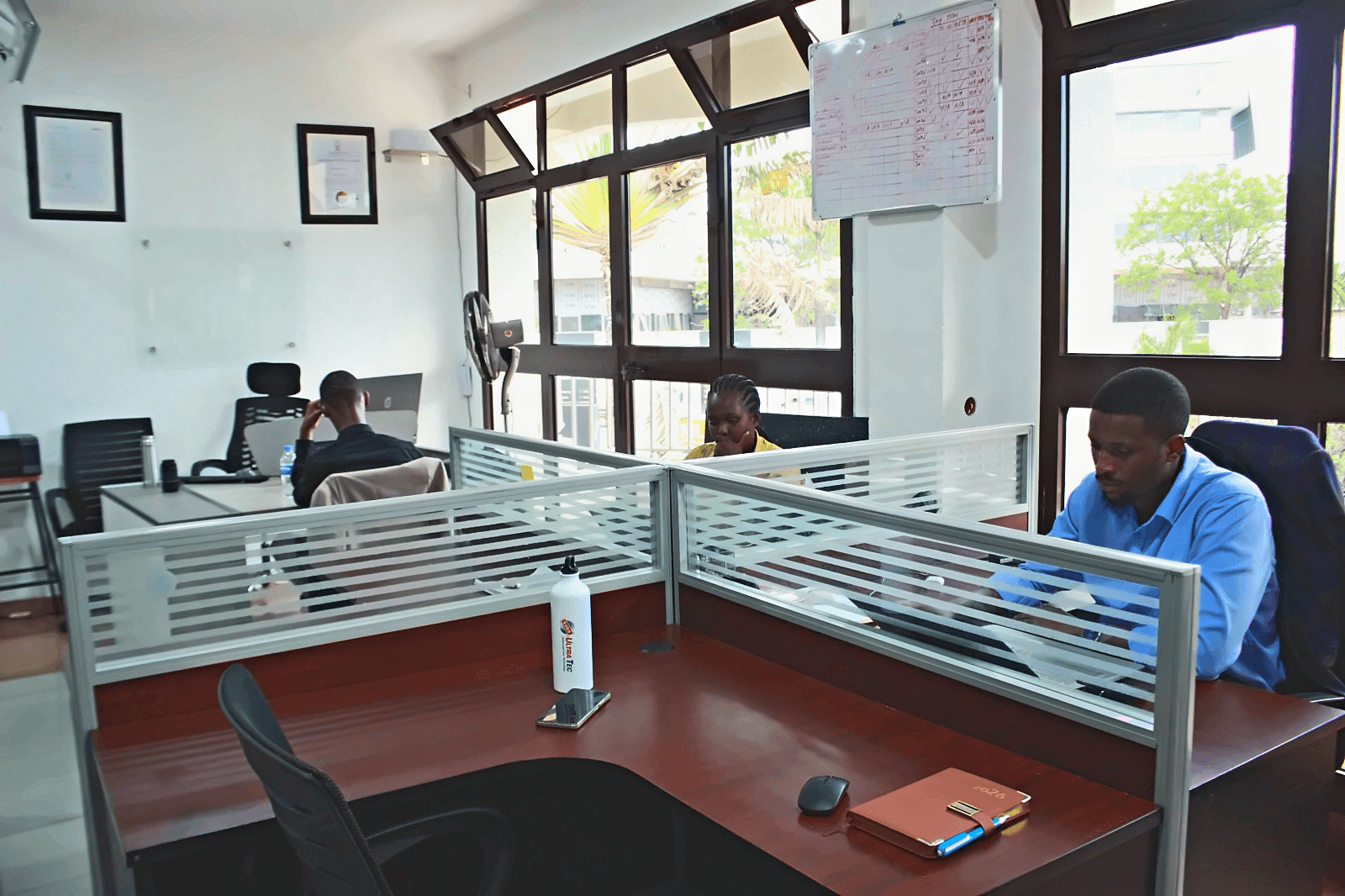 RG Partners colleagues working at their desks in the office