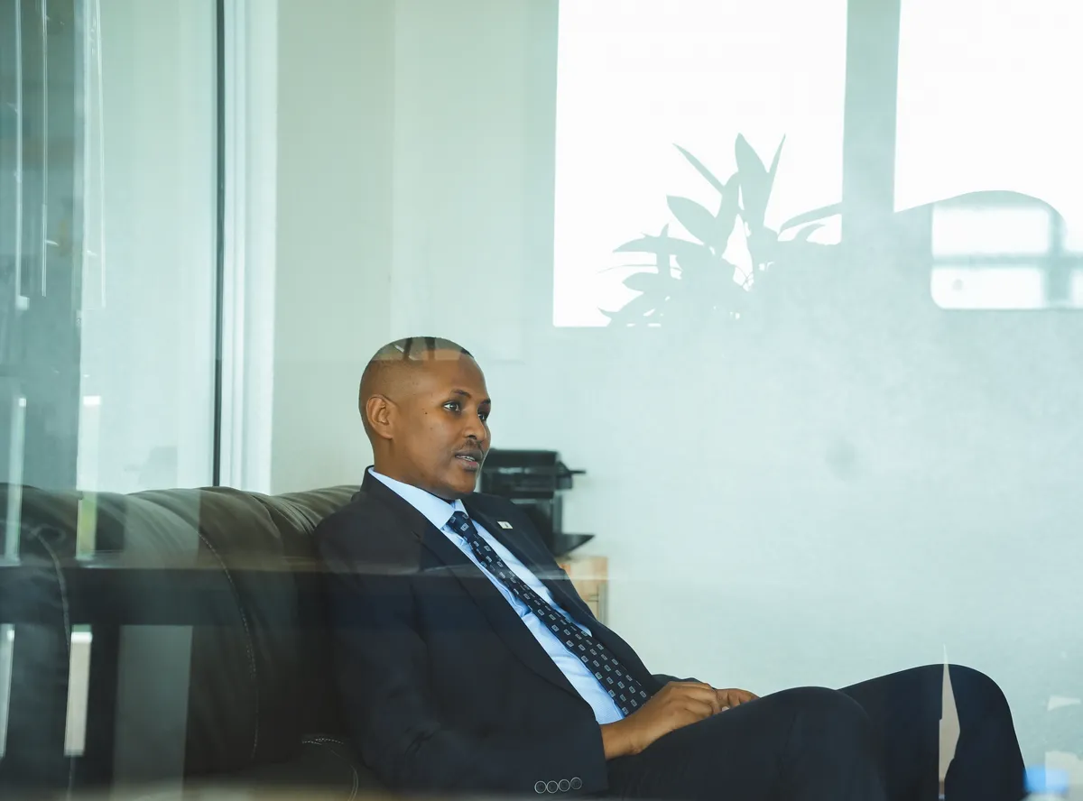 A senior RG Partners team member in conversation at the Kigali office
